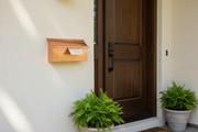 Brushed Copper Mailbox on Painted Wall