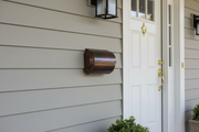 Dark Patina Copper Mailbox on House Wall