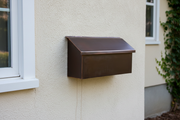 Dark Patina Mailbox on Painted Wall