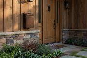 Handmade large vertical dark patina copper mailbox - lifestyle on rustic home