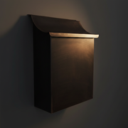 Dark patina vertical copper mailbox artistic angled shot