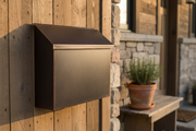 Handmade large dark patina copper mailbox - lifestyle on rustic home