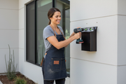 Woman Installing Copper Mailbox